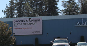 Signs of the times: grocery shopping, walking the dog, wear a mask Westhills Arena, signage, COVID-19, grocery shopping
