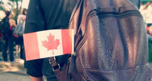 COVID TRAVEL JOURNAL: Road out of Rome Canadian flag on a backpack.