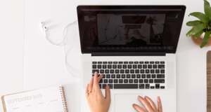 BC employees working remotely still require vaccination, highlights human rights issue working on laptop at home