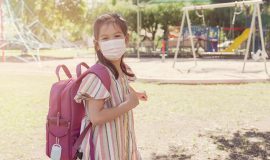 Teachers back to school first then students says Minister Fleming, SD62 open to input girl, mask, school, outdoors