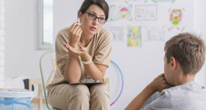 School mental health supports topped up & enhanced during COVID teacher talking to student