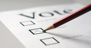 Horgan gunning to return a progressive government to BC legislature marking ballot, pencil