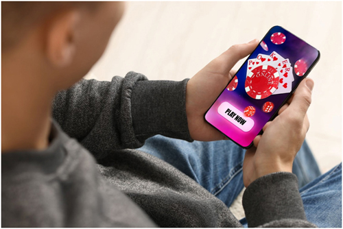 Holding-iPhone-500px iphone, gambling